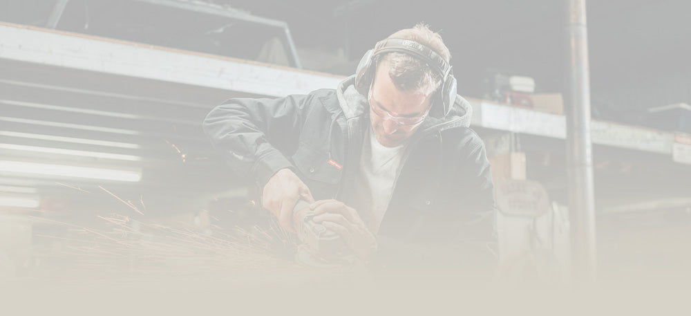 Person wearing headphones in a car with a blurred background